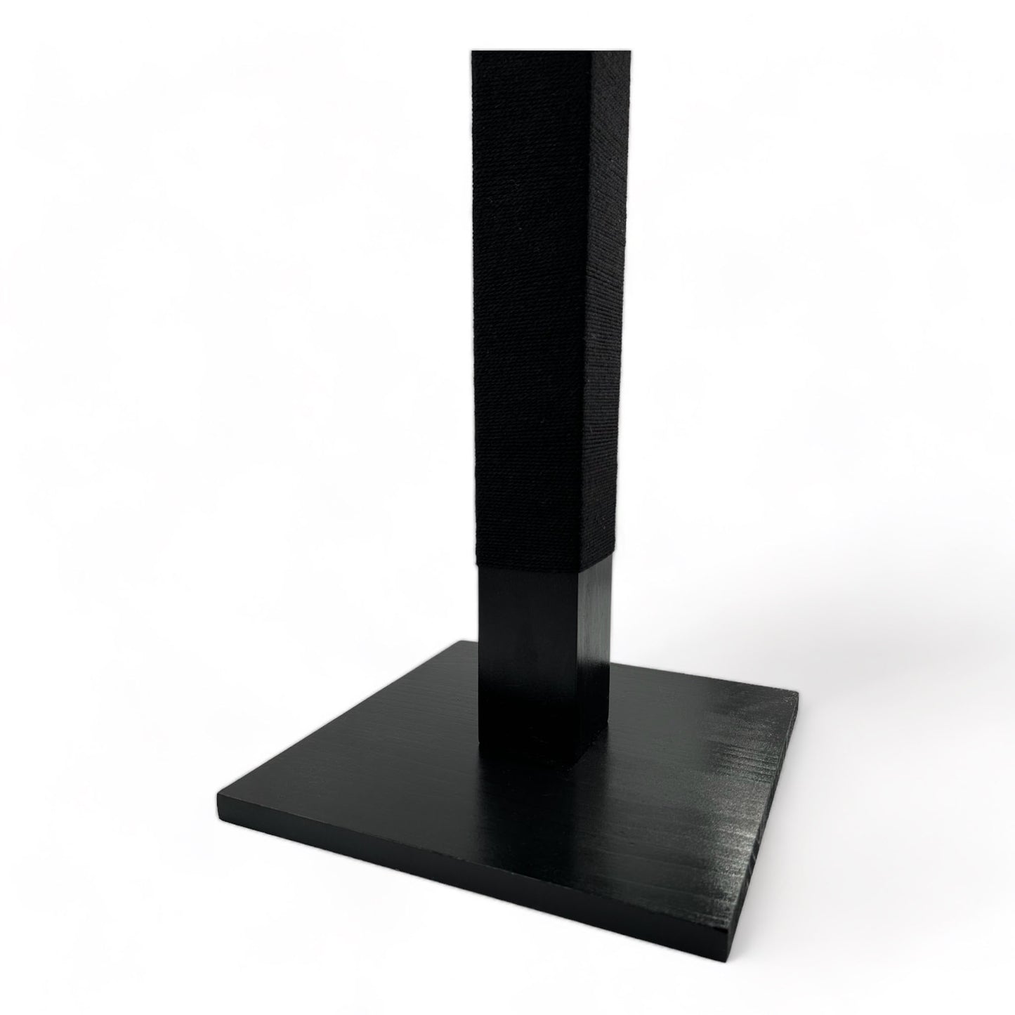 Bottom half of black reusable solid wood cat scratching post looped in black cotton cord 