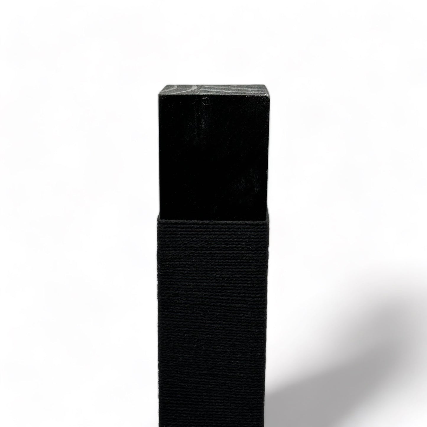 Top of reusable solid wood cat scratching post looped in black cotton cord 