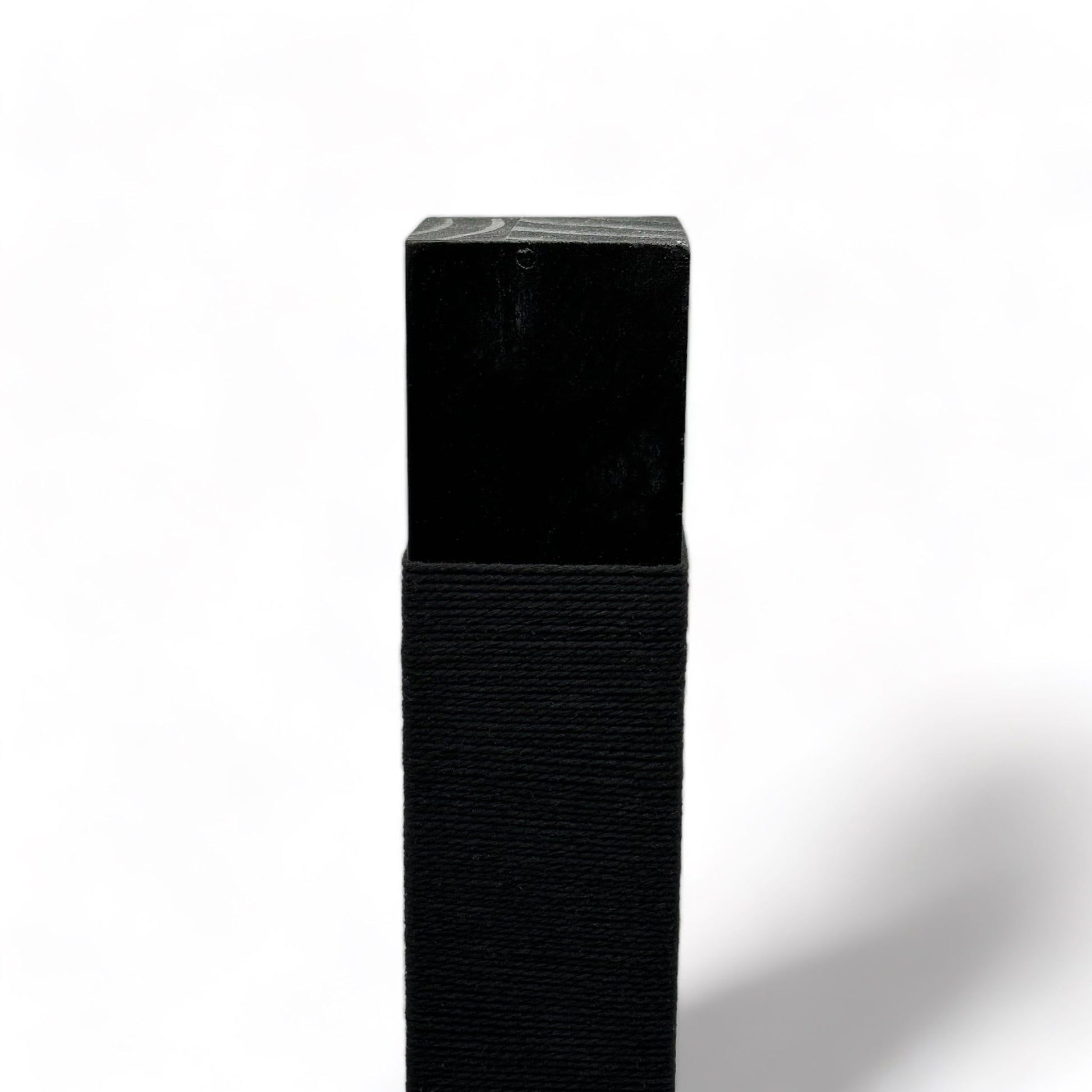 Top of reusable solid wood cat scratching post looped in black cotton cord 